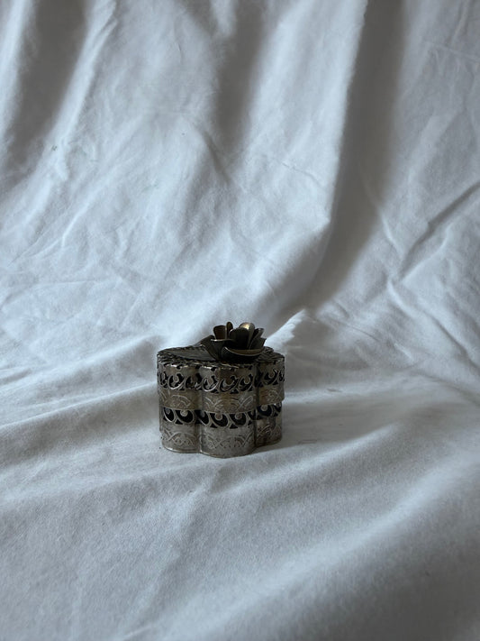 Pierced metal flower box with rose lid