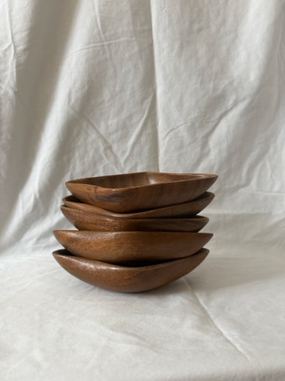 Stack of five monkeypod wood diamond dishes